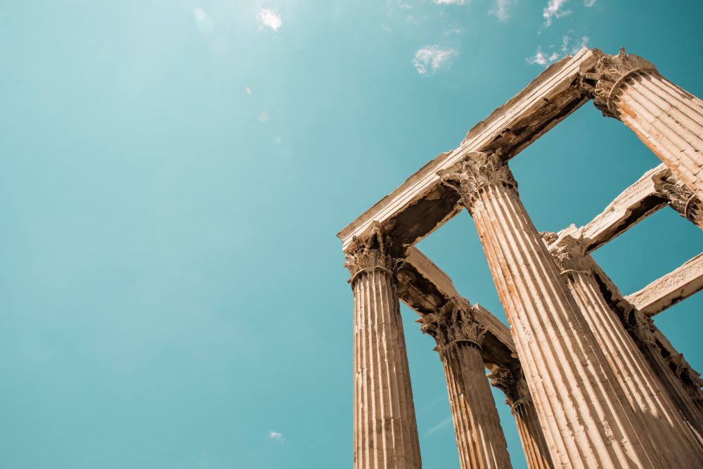 low-angle-shot-columns-acropolis-pantheon-athens-greece-sky